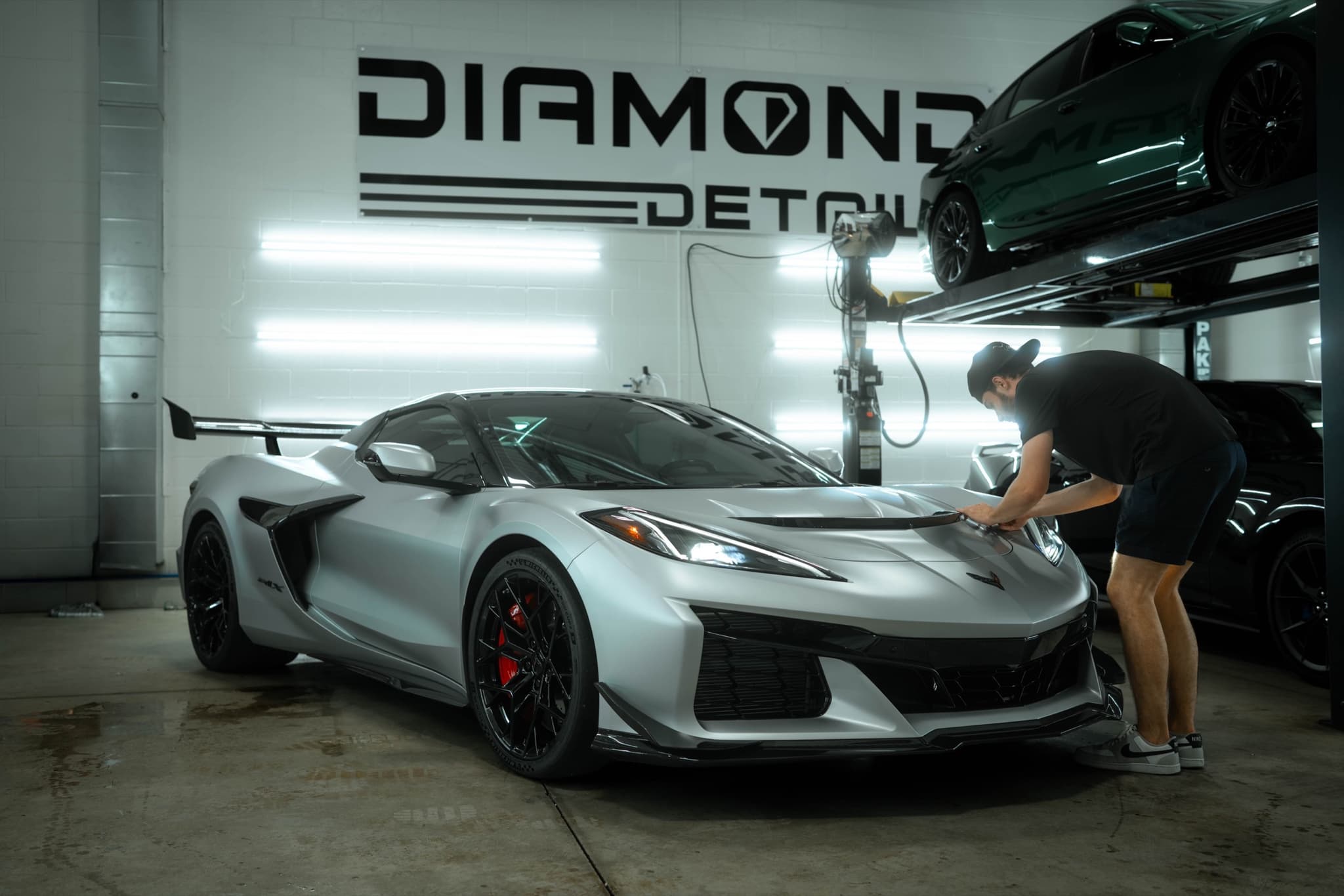 Diamond Detailz installer applying paint protection film to a Corvette Z06